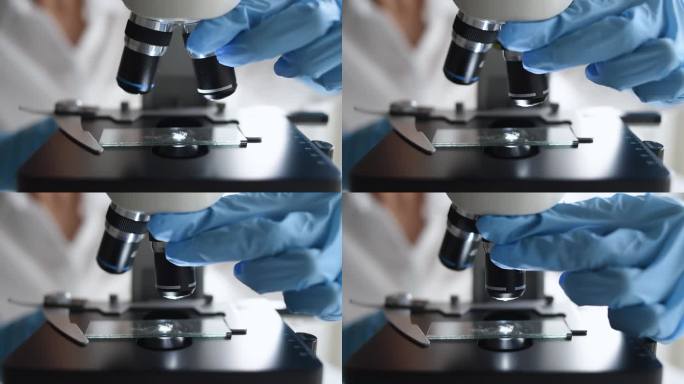科学家，微生物学家或学生在实验室使用显微镜，进行医学测试和研究