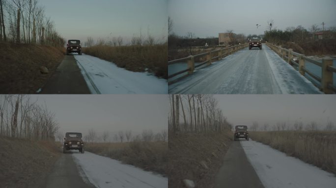 冬天吉普车行驶在北方乡村小道道路