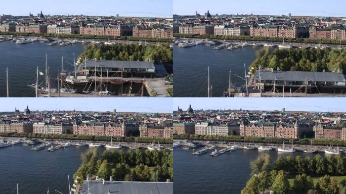 帆船在码头与城市天际线背景在阳光明媚的夜晚，斯德哥尔摩，瑞典。向前推动。