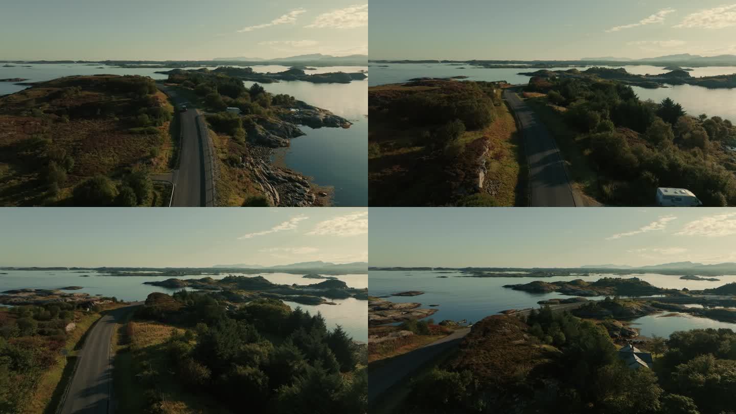 在阳光明媚的日子里，一架无人机在美丽的斯堪的纳维亚风景中沿着大西洋的小岩石岛屿飞行