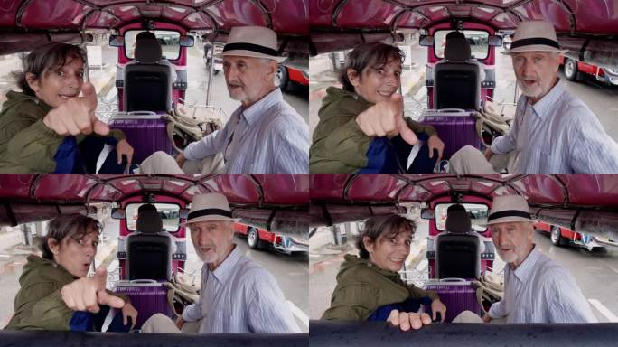 乘坐嘟嘟车游览清迈当地的大巴车，年迈的白种人夫妇在一辆嘟嘟车的后座上注视着旅游景点。