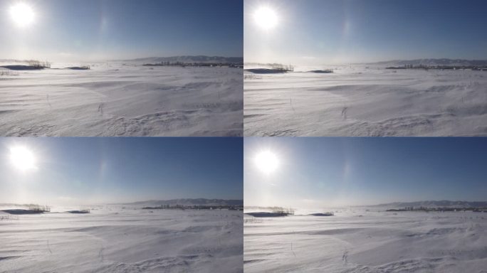 极寒天气下风吹动马路上的雪花