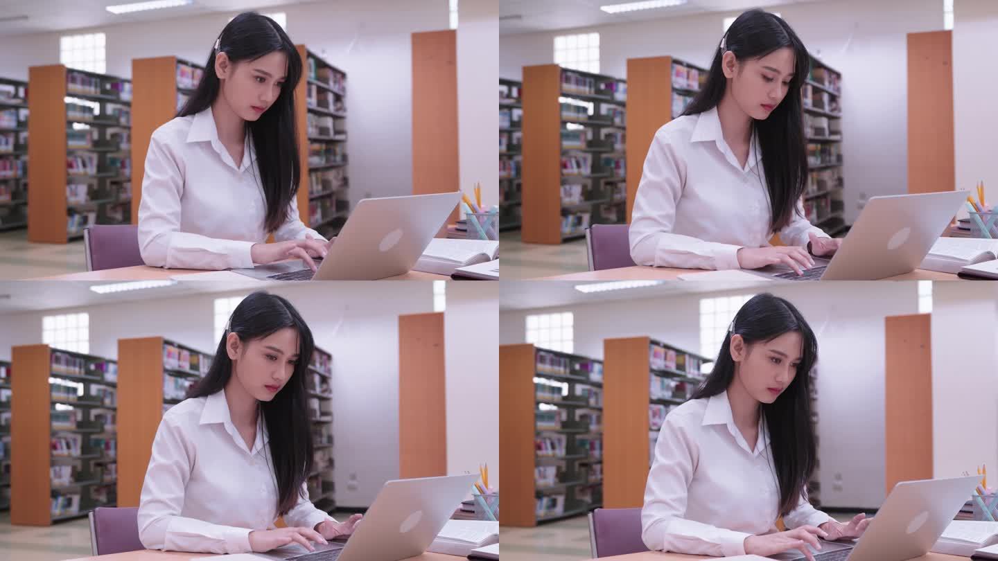 年轻的亚洲女大学生们正在用笔记本电脑认真地完成作业，在网上提交作业，参加网上课程，或在大学图书馆准备