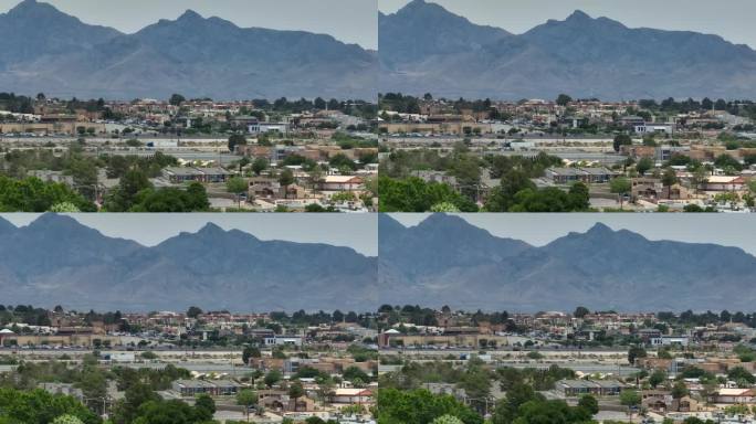 美国西南部的房屋和住宅被沙漠中高大的山脉所笼罩。