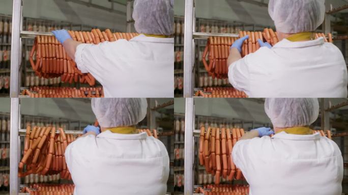 工人在冷藏仓库的架子上储存加工过的香肠