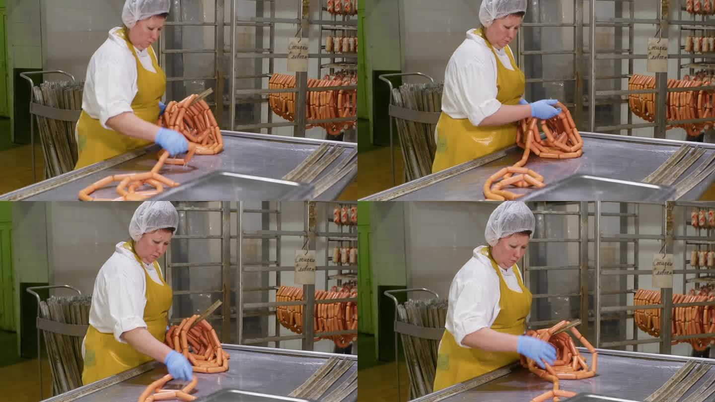 工人在冷藏仓库里收集加工过的香肠