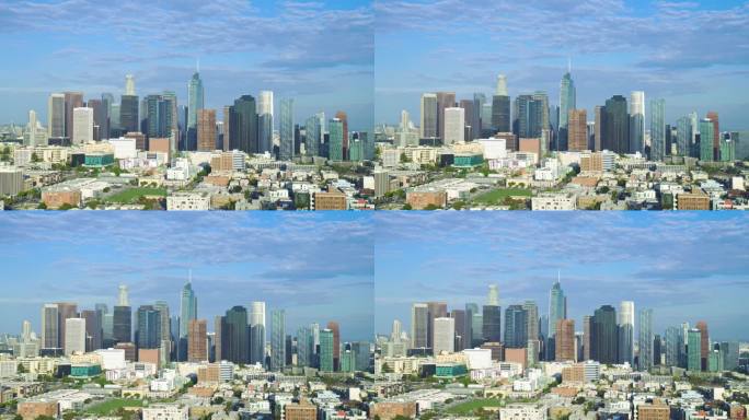 无人机从左至右建立全景洛杉矶加利福尼亚摩天大楼，戏剧性的灰色多云天空