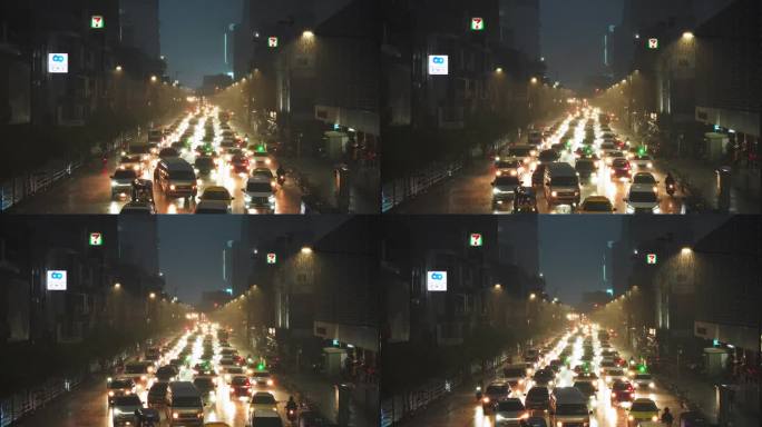 在一个雨夜的城市里，许多汽车行驶在城市道路上。