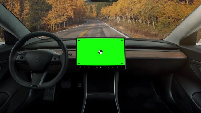 配备绿色屏幕中控台屏幕的自动驾驶电动汽车。