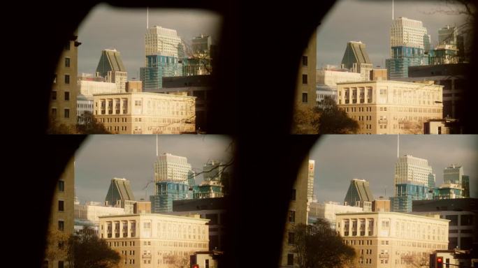 从一辆行驶中的汽车的窗户看到的蒙特利尔的手持镜头