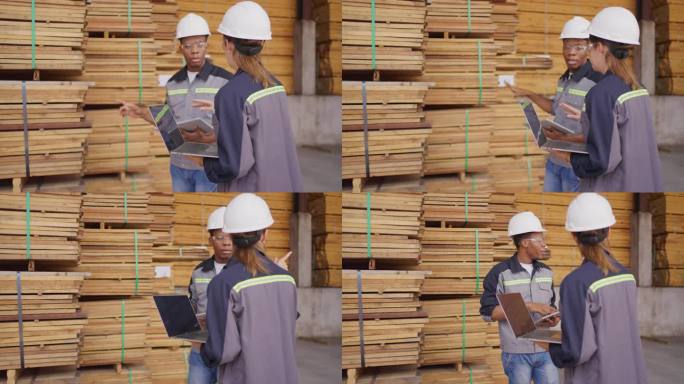 木材厂的工人检查库存。
