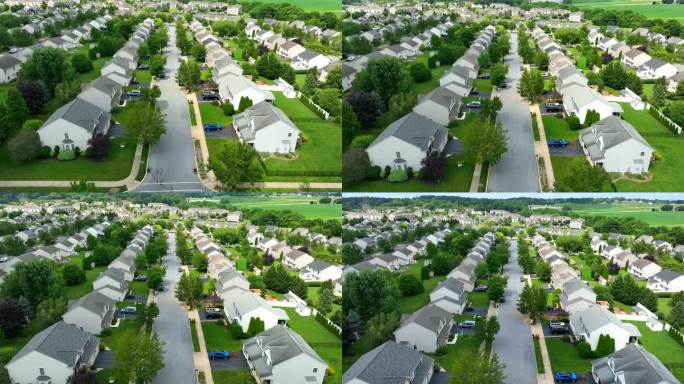 一个美国的郊区社区延伸开来，整齐的房子排列在道路两旁，汽车停在那里，绿树成荫的草坪。天线倾斜向上显示
