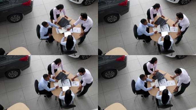 拉丁美洲销售团队在一家汽车经销商的业务会议上共同制定销售策略