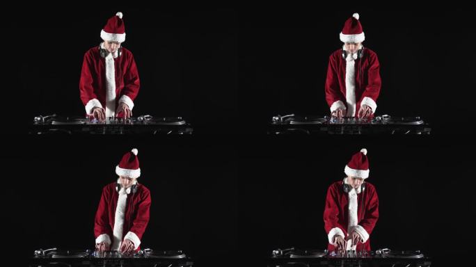 圣诞老人Dj在夜总会的圣诞晚会上演奏音乐