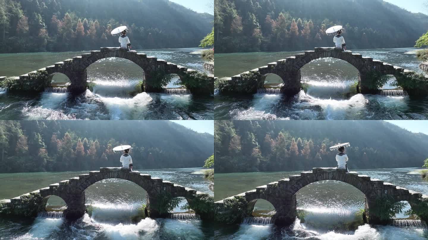 古风女孩打卡湖南湘西沱江网红桥石拱桥实拍