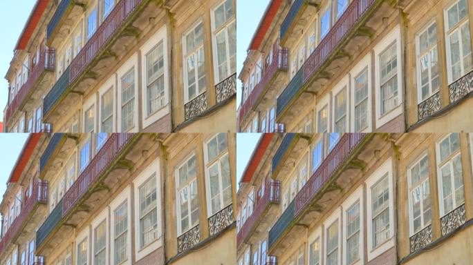 葡萄牙波尔图的历史建筑立面和玻璃窗。宽