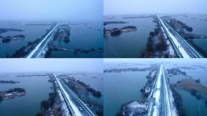 冬天大雪雪景湖泊汽车飞驰新能源航拍素材