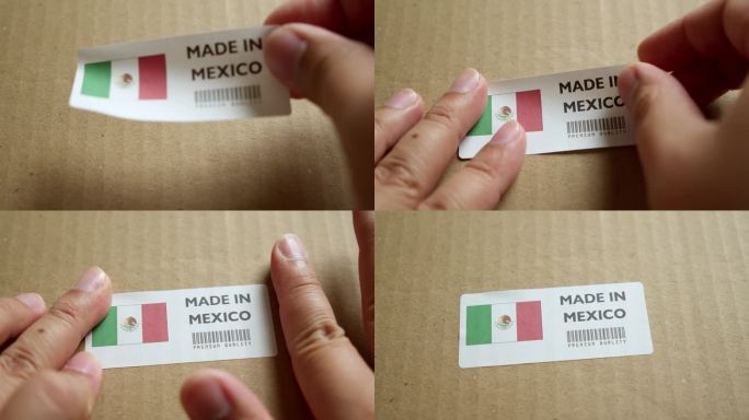 用手将墨西哥制造的旗帜标签贴在带有产品优质条形码的运输箱上。制造和交付。产品出厂进出口。