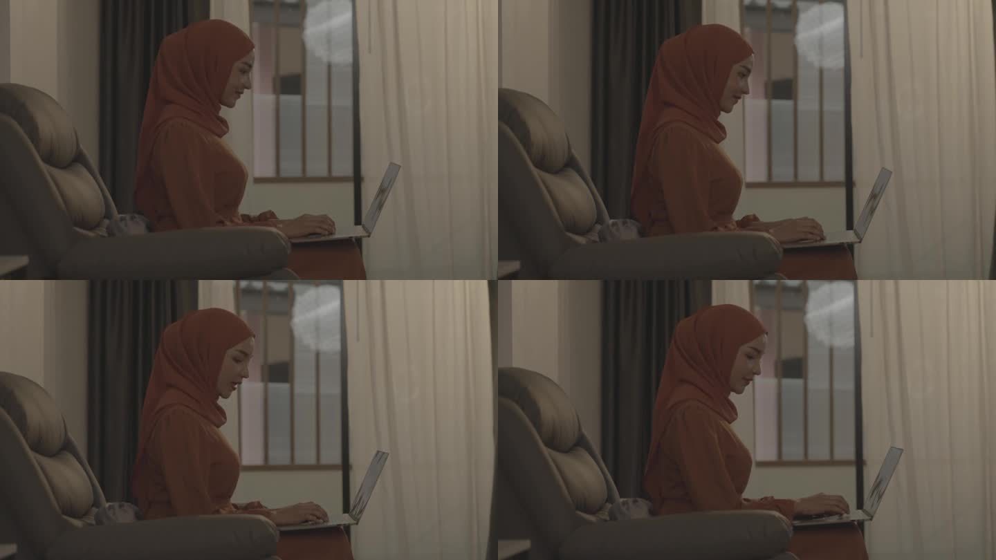 年轻貌美的穆斯林女性在家远程办公。