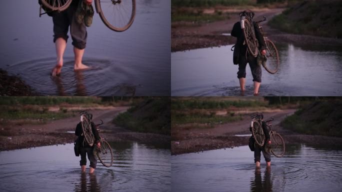 男人扛着自行车 过河