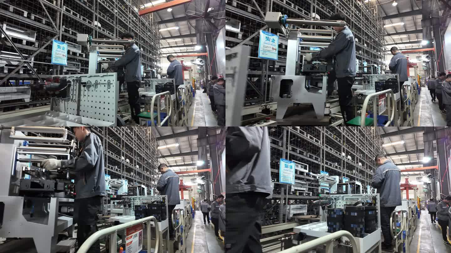 工人在车间生产流水线上装配机器零件