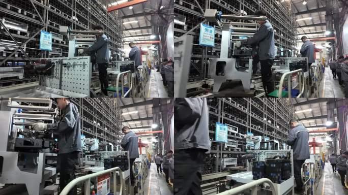 工人在车间生产流水线上装配机器零件