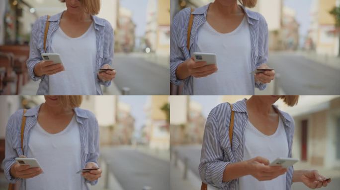 在克罗地亚的城市里，一名女游客在走路时使用信用卡和智能手机