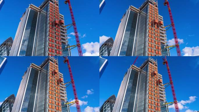 低角度商业现代建筑摩天大楼与云层之间的反射与小黄瓜，又名30 st标记斧在伦敦市中心，英国