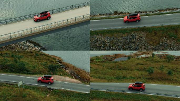 绿色北欧风景中，红色SUV轿车驶下大桥和道路的特写