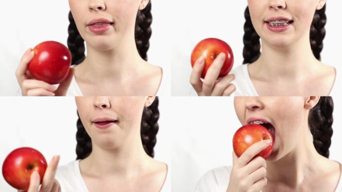戴牙套的年轻白人妇女不能吃苹果的特写。白色背景。正畸治疗中禁忌食物的概念