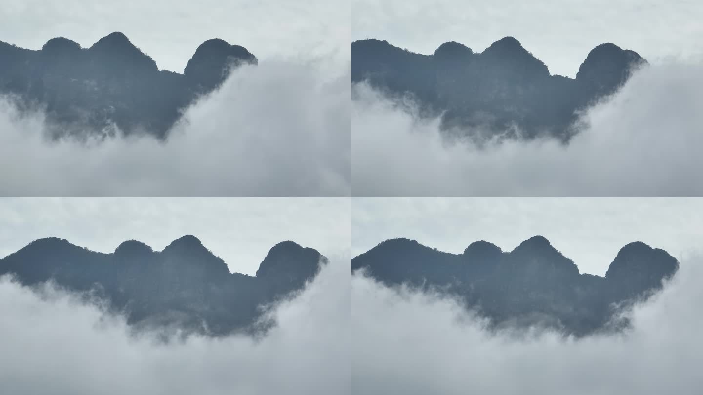 航拍云雾缭绕下的山峰云层之中来宾圣堂山