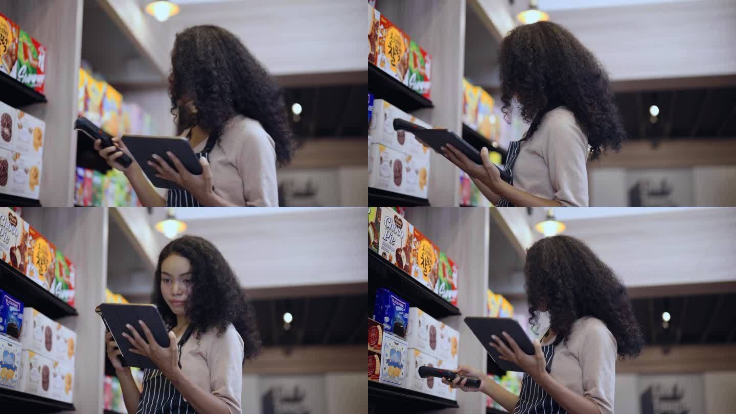 年轻女子在超市用条码扫描器检查大货架上的商品。