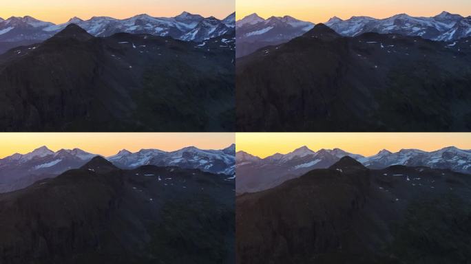 山地景观动态缓慢稳定无人机拍摄日落在高山环境与层层山脉
