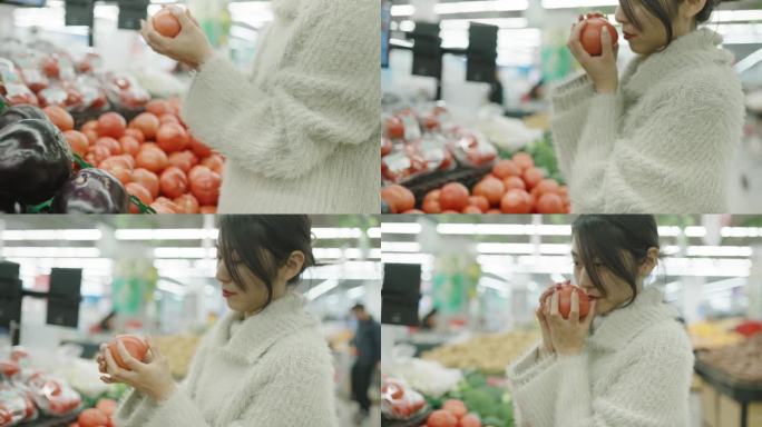 年轻妇女在超市买蔬菜