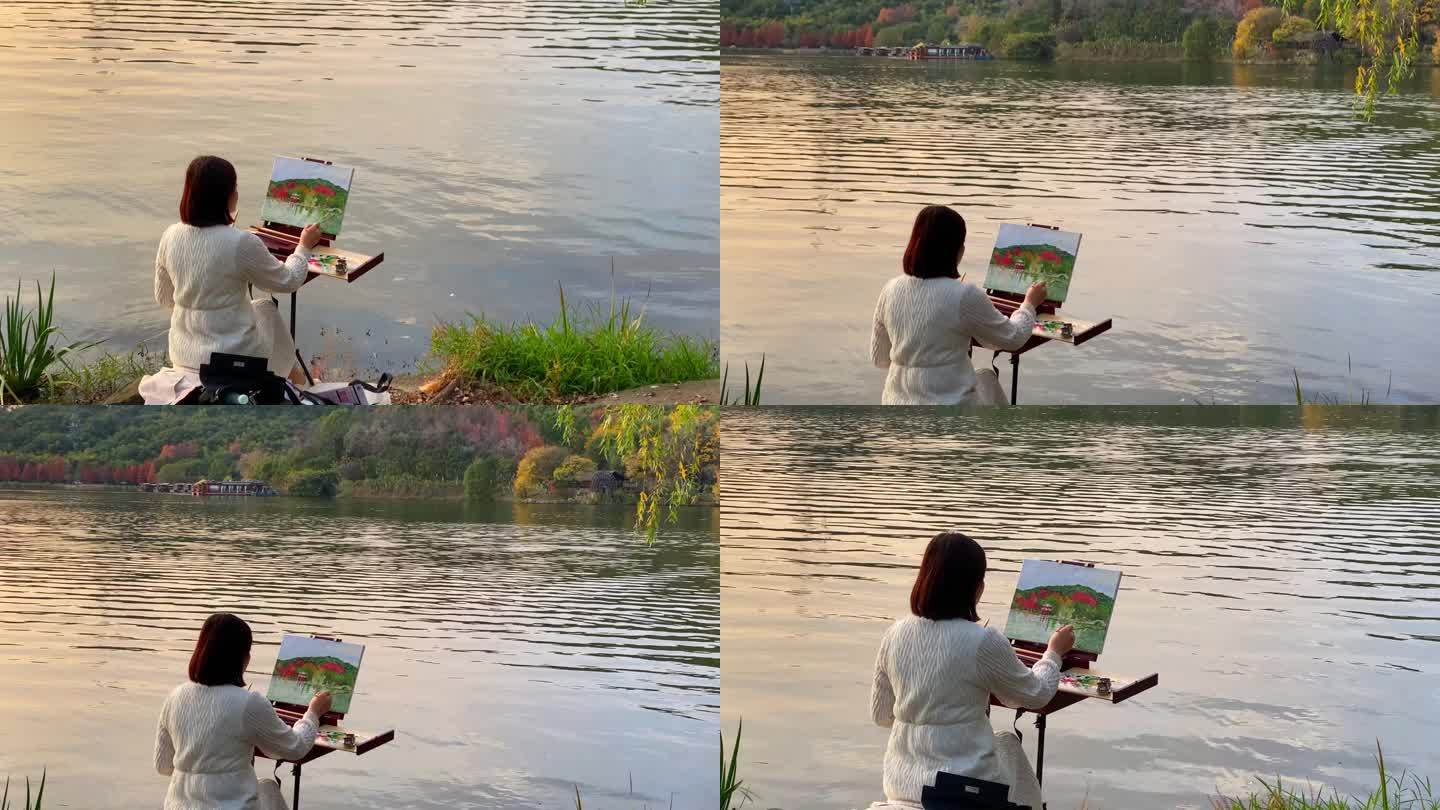 杭州湖边画画休闲的女子