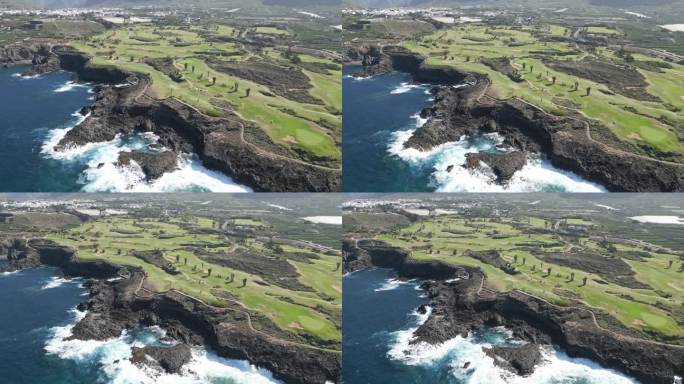 史诗悬崖边的高尔夫球场俯瞰美丽的蓝色海洋在西班牙特内里费岛，空中视差