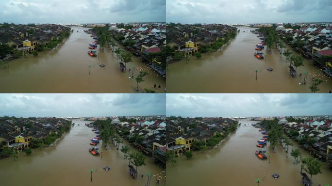 无人机拍摄的越南会安镇洪水过后，被水淹没的街道上船只代替汽车的画面