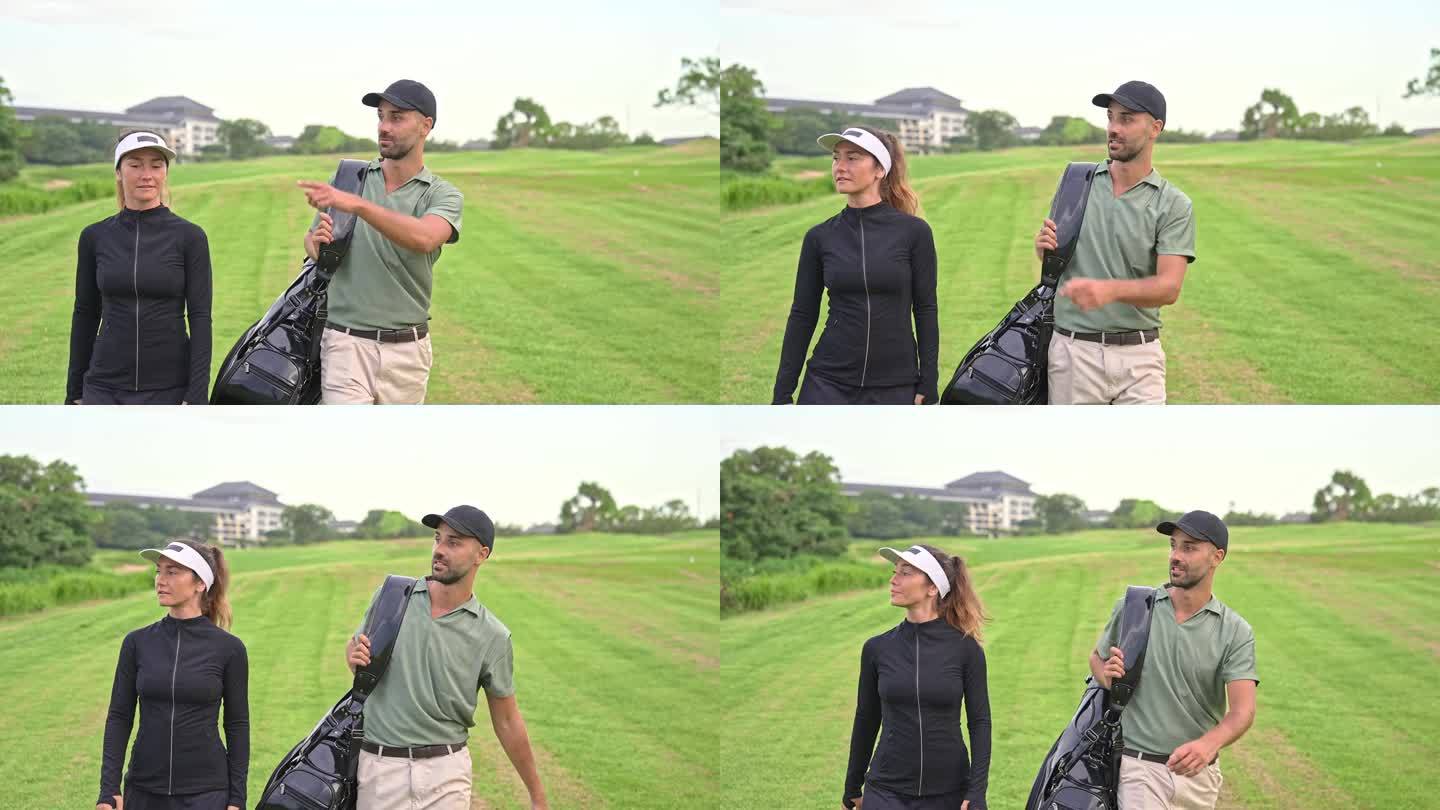 男运动员和女运动员带着球棒和球袋走在高尔夫球场上。幸福的白人夫妇准备玩推杆游戏。职业男性与培训女性的