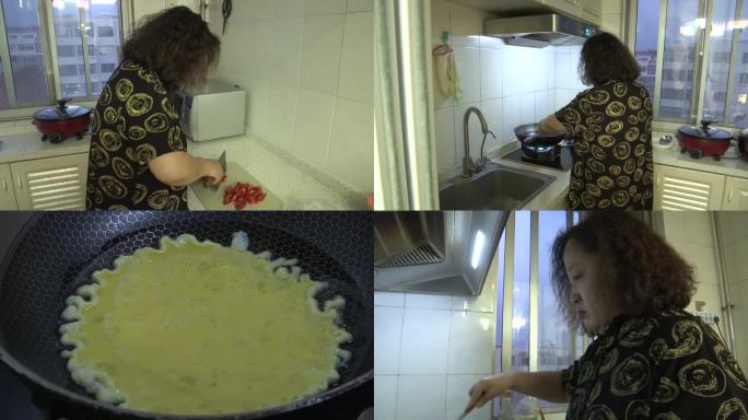 母女亲子二人在楼房做饭炒菜柿子炒鸡蛋家务