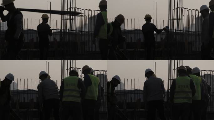 建筑工地繁忙的建筑工人剪影