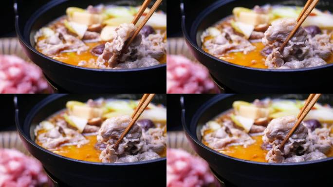 中国麻辣火锅。一个炖蔬菜和羊肉的视频。