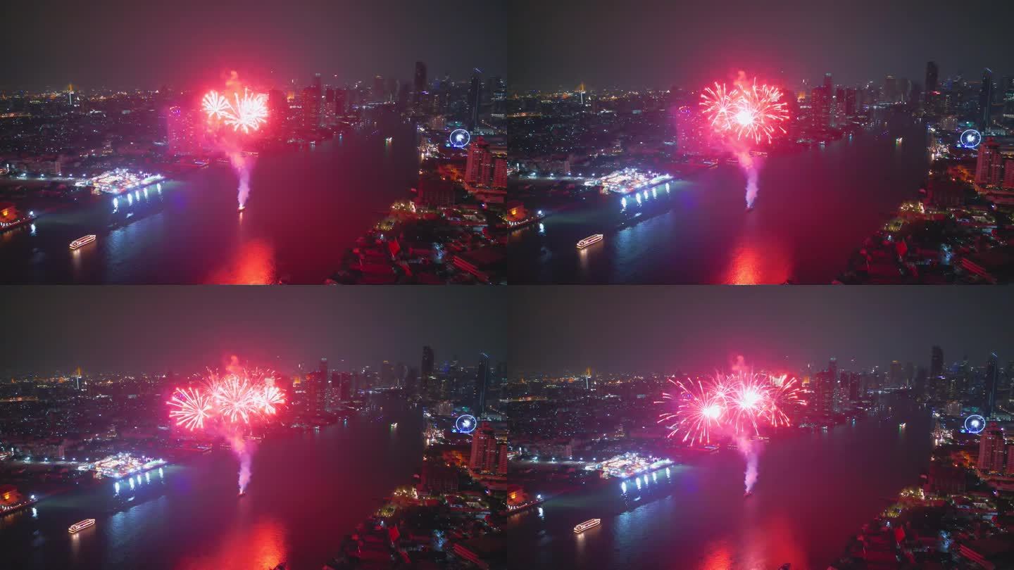 空中无人机的视角多色烟花表演在天空之城。除夕夜。摩天大楼和城市景观庆祝夜晚的灯光
