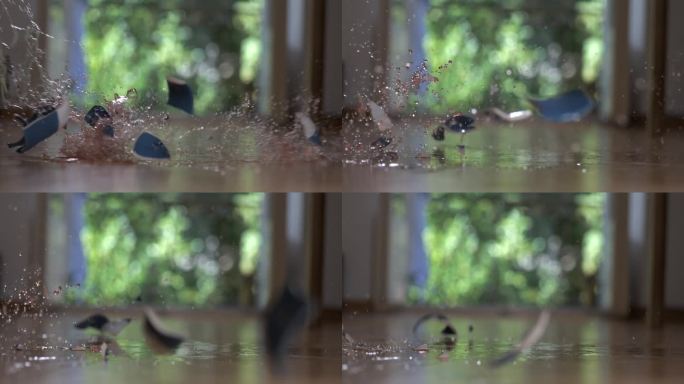 茶杯掉在地上摔成碎片的超慢镜头被高速摄像机捕捉到。瓷质物体破碎的事故概念