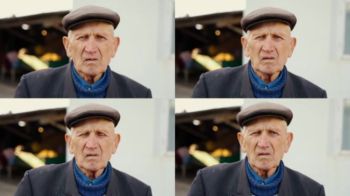 一个满脸皱纹的老人看着镜头的特写。