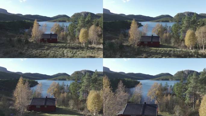 俯瞰挪威希尔德雷姆斯瓦内特湖山的田园诗般的房子。无人机航拍