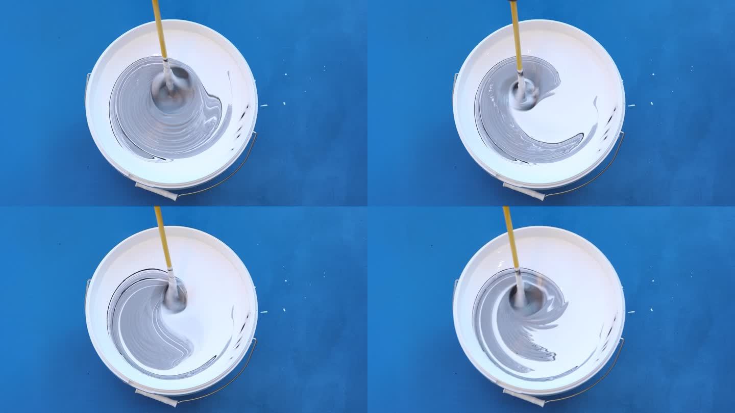 油漆搅拌器是将三种油漆颜色放在墙漆桶中进行混合和搅拌。