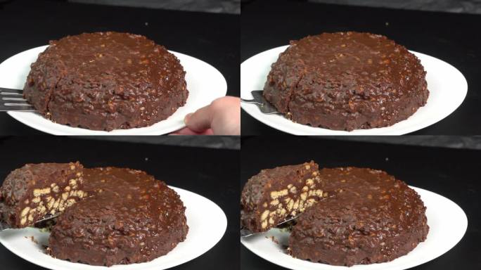厨师用锅铲铲起一块巧克力蛋糕，端给客人。自制蛋糕或甜点