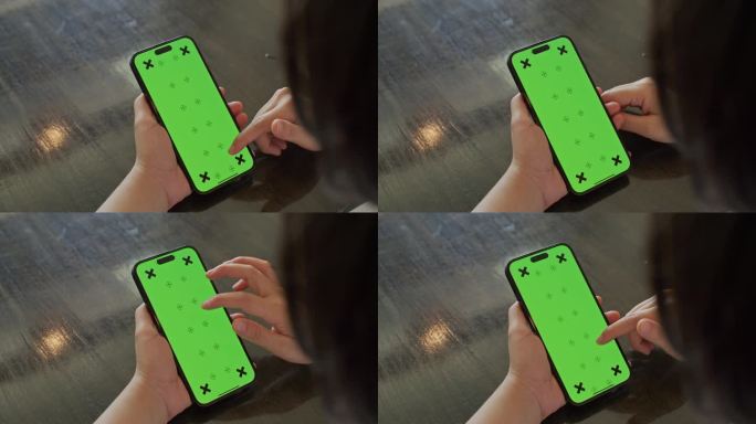 手持智能手机的女人，绿色屏幕模板的特写