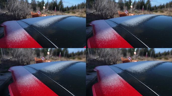 在冬季寒冷的季节，汽车表面上结霜的雪