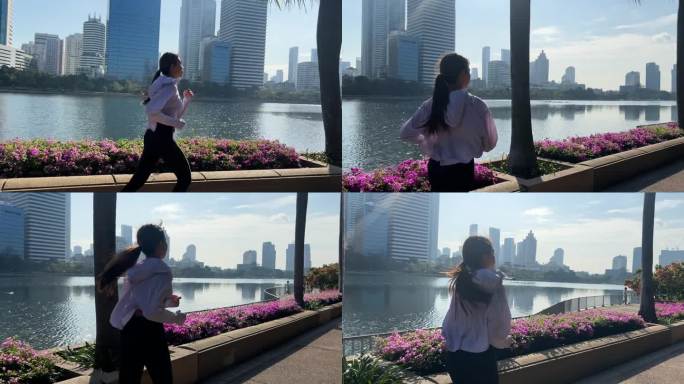 慢动作亚洲运动女子在湖边的城市跑步
